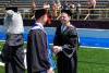 Paul Bascobert shaking hand of recent Kettering graduate